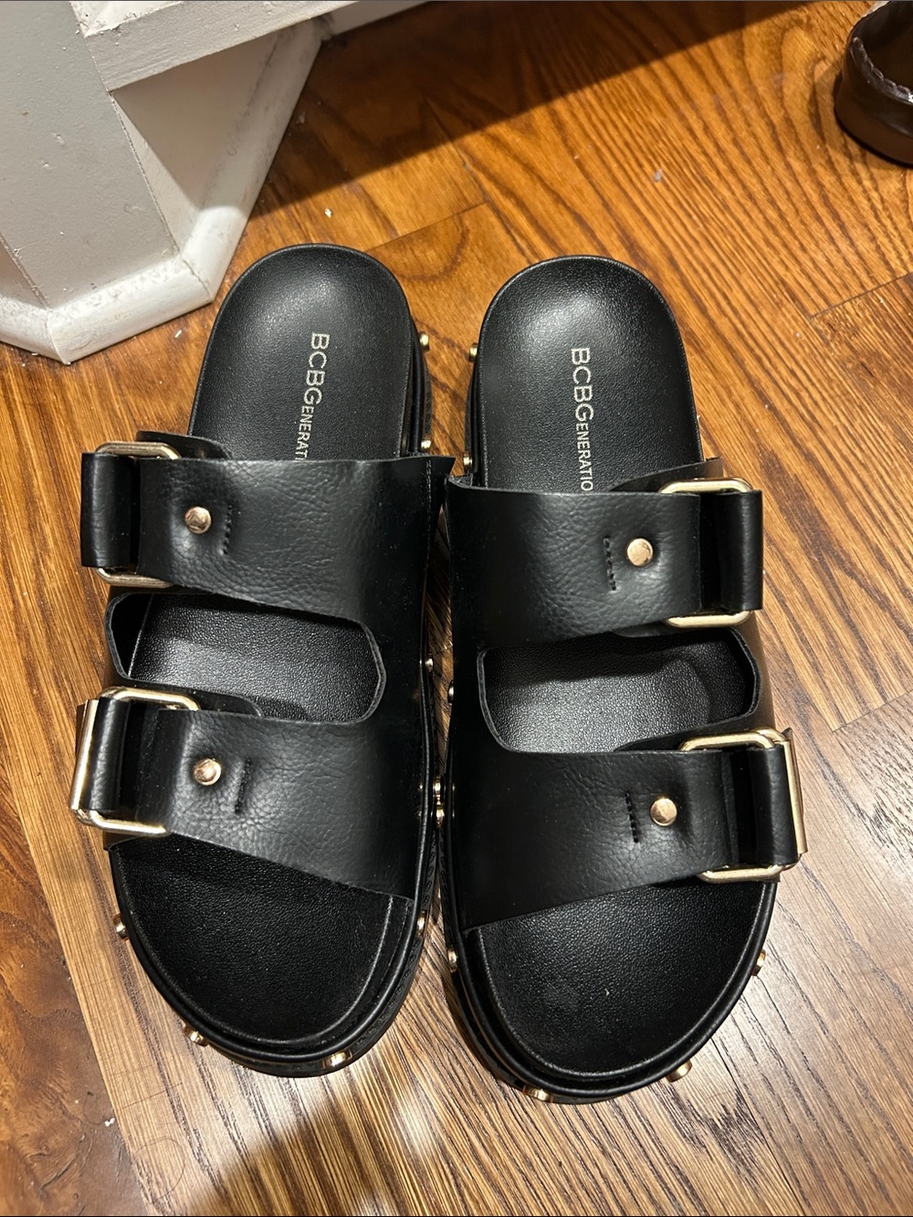 BCBGeneration Black Slide Sandals with Gold Buckles